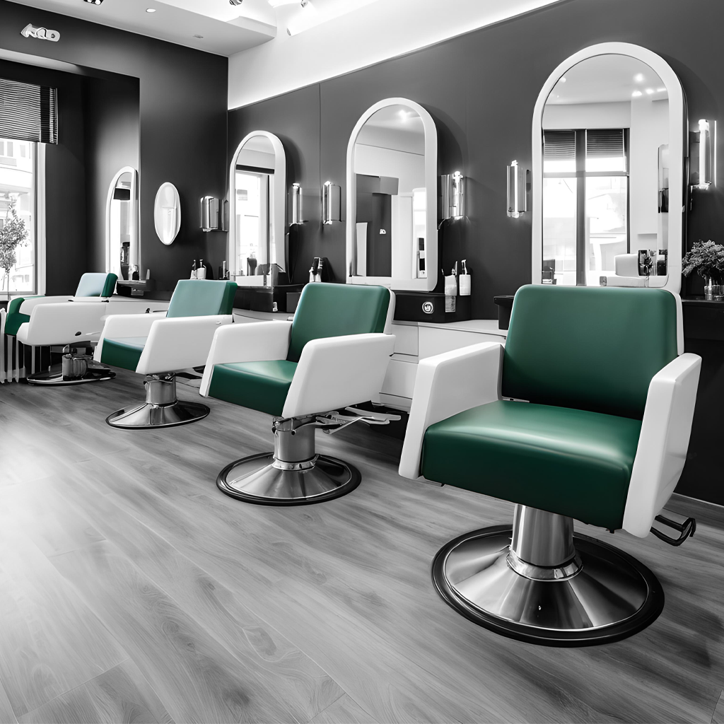 un salone per hair stylist in bianco e nero con i sedili colorati di verde